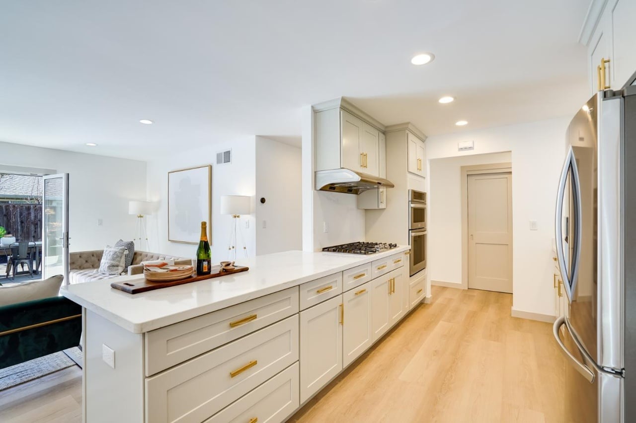 white kitchen cabinets in a new kitchen remodel by a kitchen remodeling company