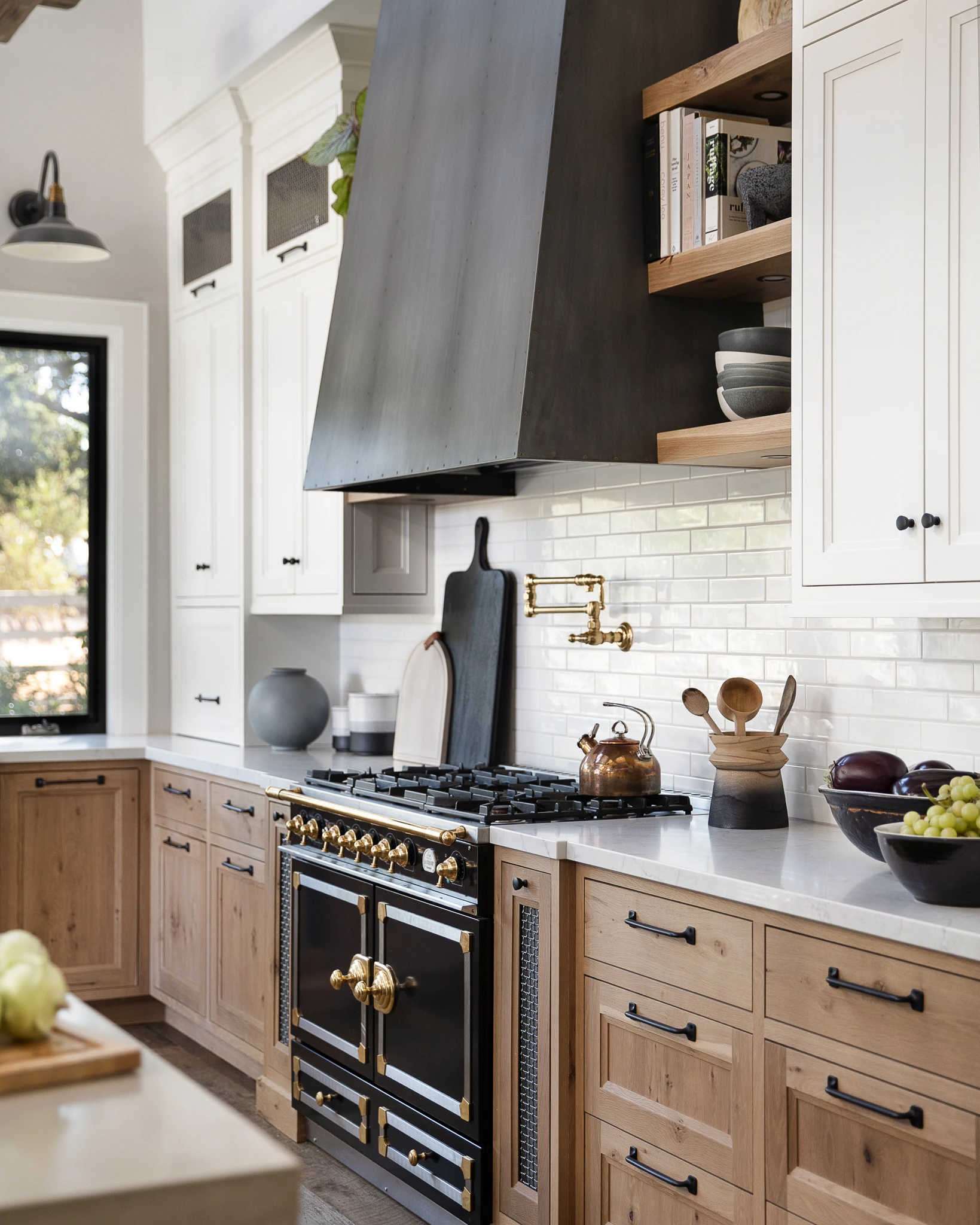 Kitchen with white upper cabinets and light oak lower drawers